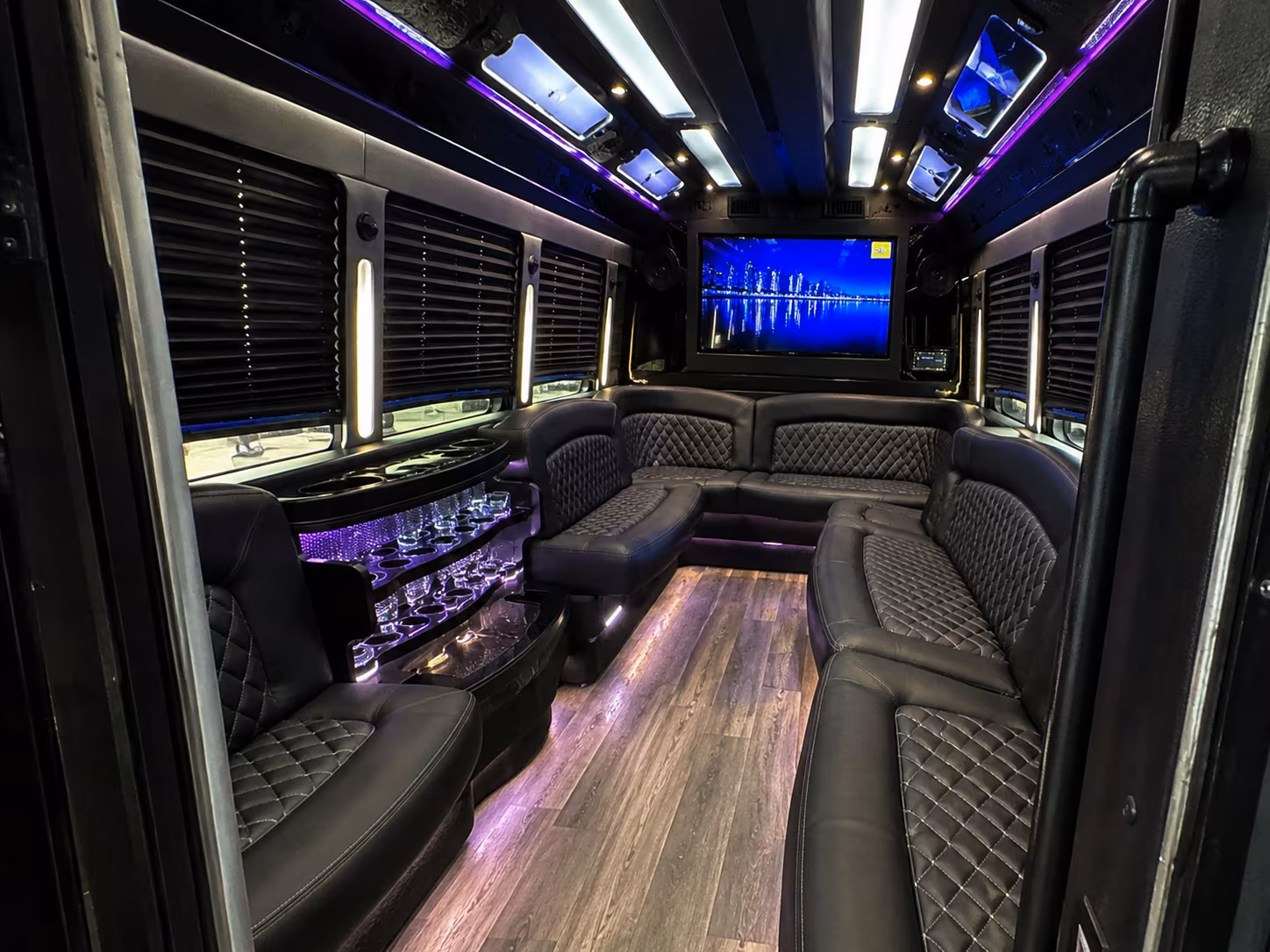 Wedding guests seated inside a party bus serving Jackson